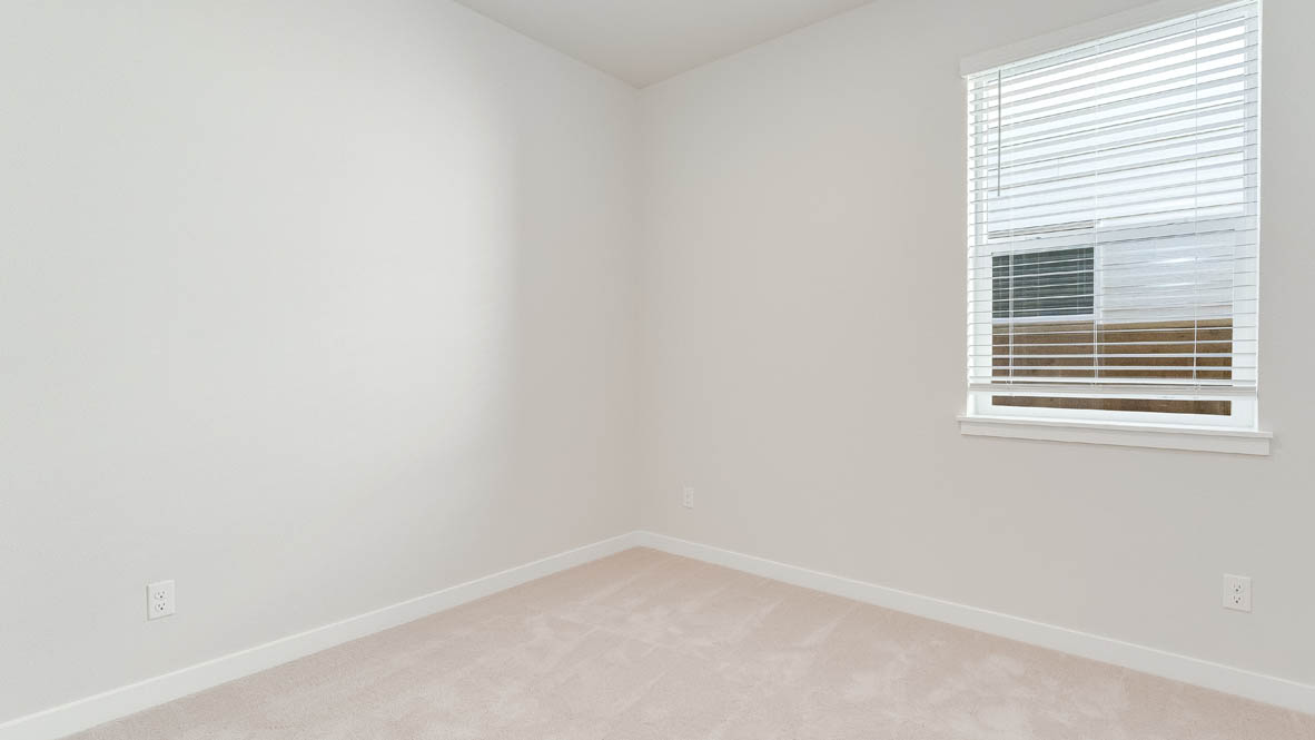 Davis Estates bedroom with carpet, window, and white walls