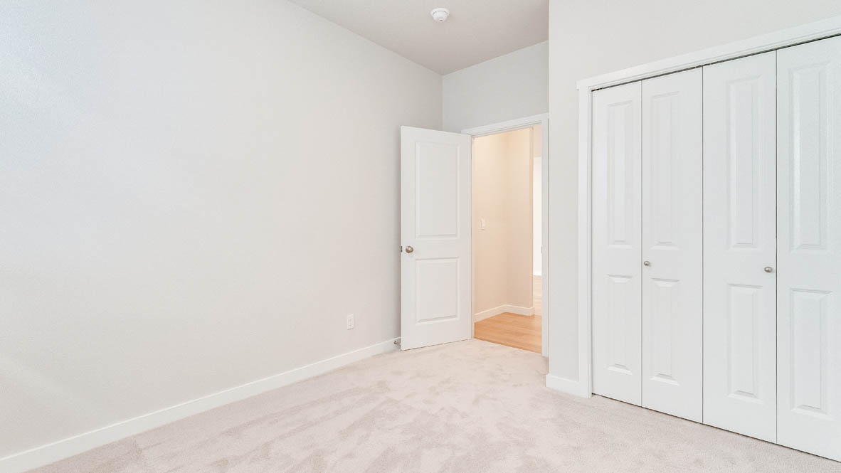 Davis Estates bedroom with carpet, and closet