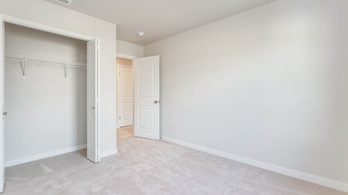 Davis Estates bedroom with carpet, and closet