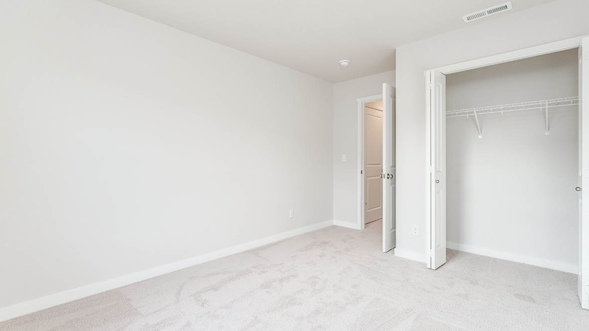 Davis Estates bedroom with carpet, and closet