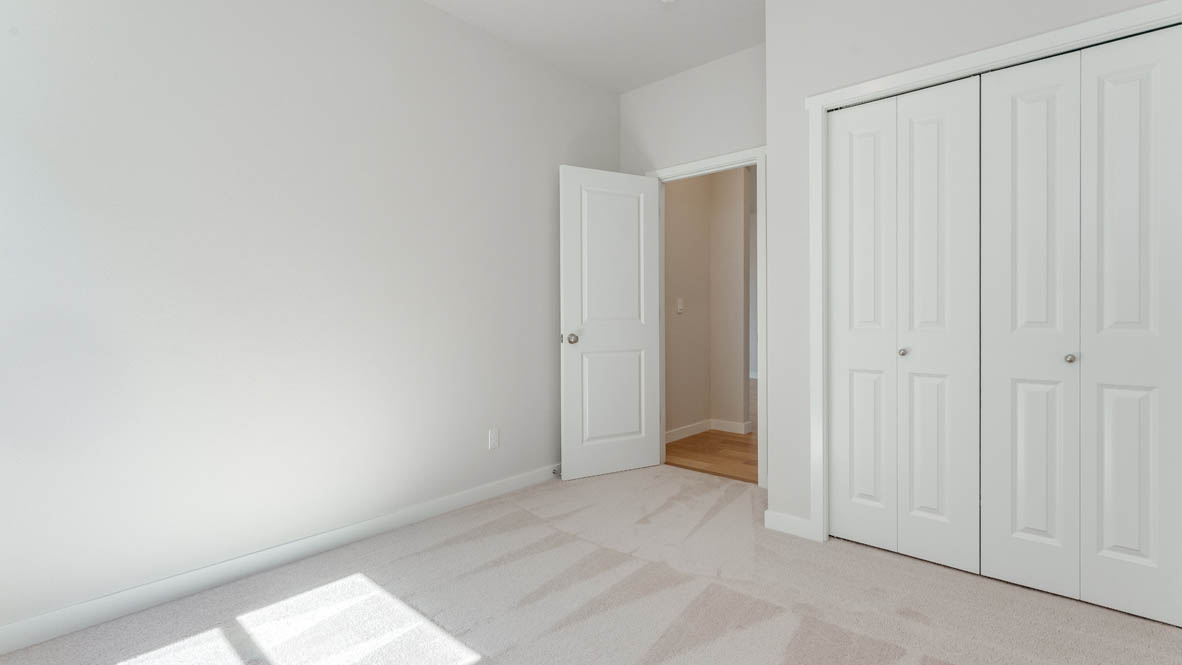 Davis Estates bedroom with carpet, and closet