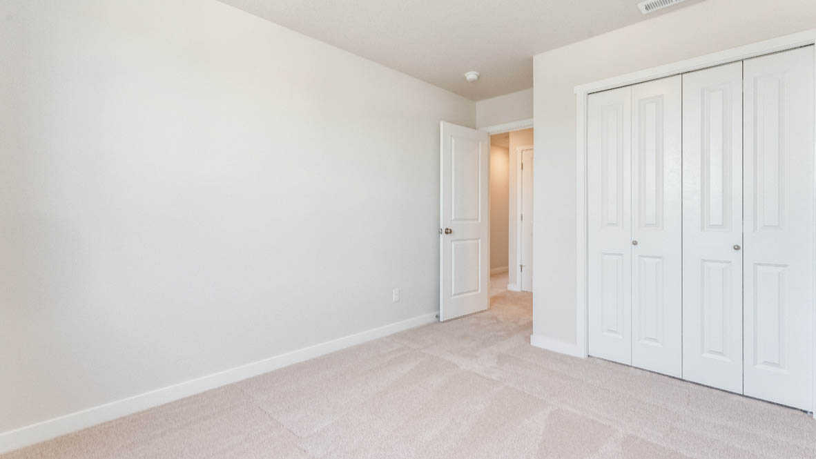 Davis Estates bedroom with carpet, and closet