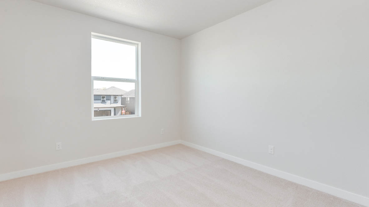 Davis Estates bedroom with carpet, window, and white walls