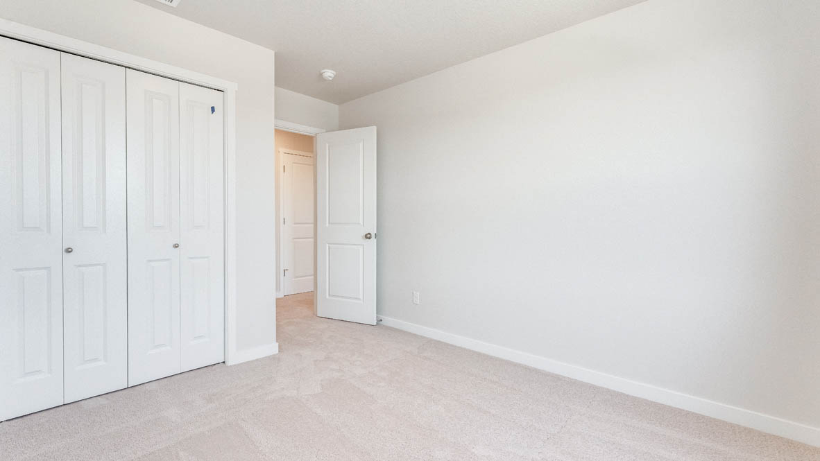 Davis Estates bedroom with carpet, and closet