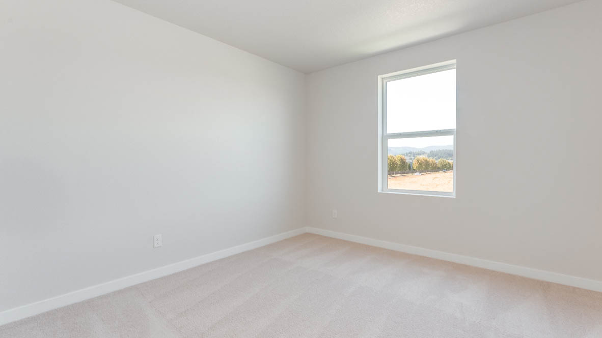 Davis Estates bedroom with carpet, window, and white walls
