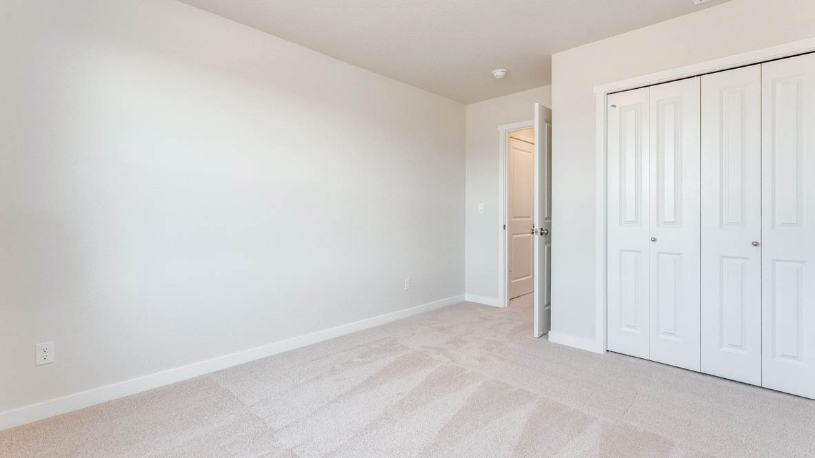 Davis Estates bedroom with carpet, and closet