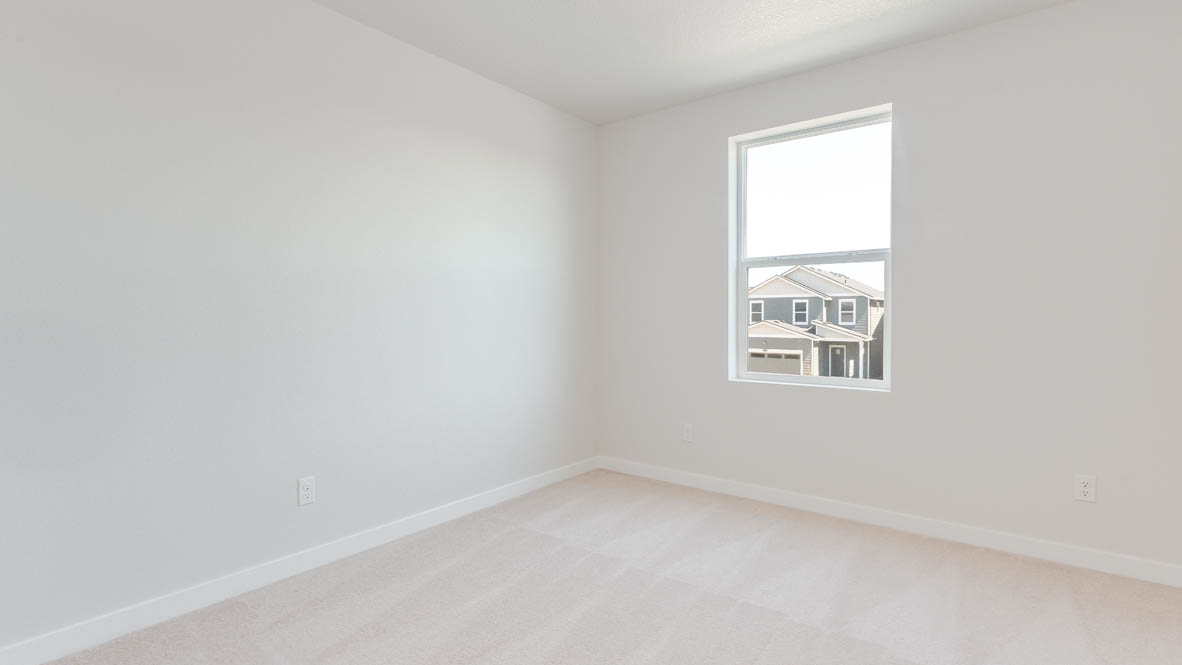 Davis Estates bedroom with carpet, window, and white walls
