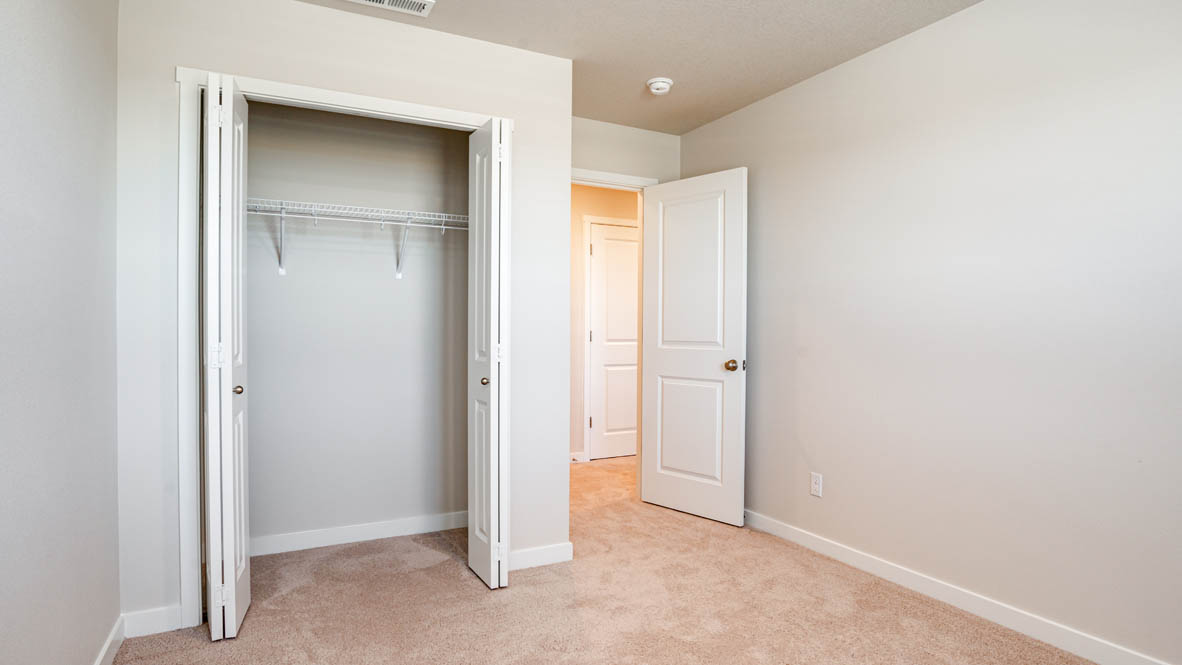 Davis Estates bedroom with carpet, and closet