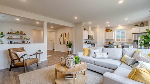 Marcola Meadows great room shown from the front left corner to show the dining room on the left and the kitchen on the right