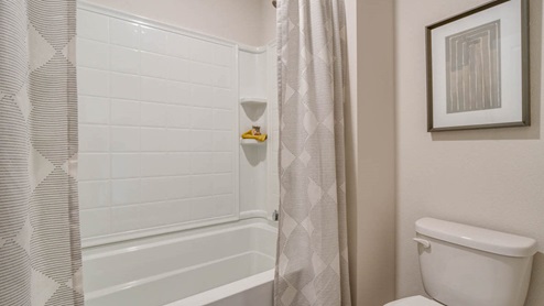 Marcola Meadows Bathroom with tub shower and curtains and a toilet