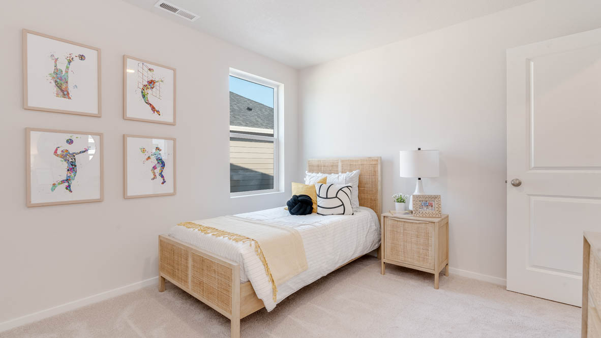 Marcola Meadows bedroom with nightstand, lamp, four paintings, window, and a closet