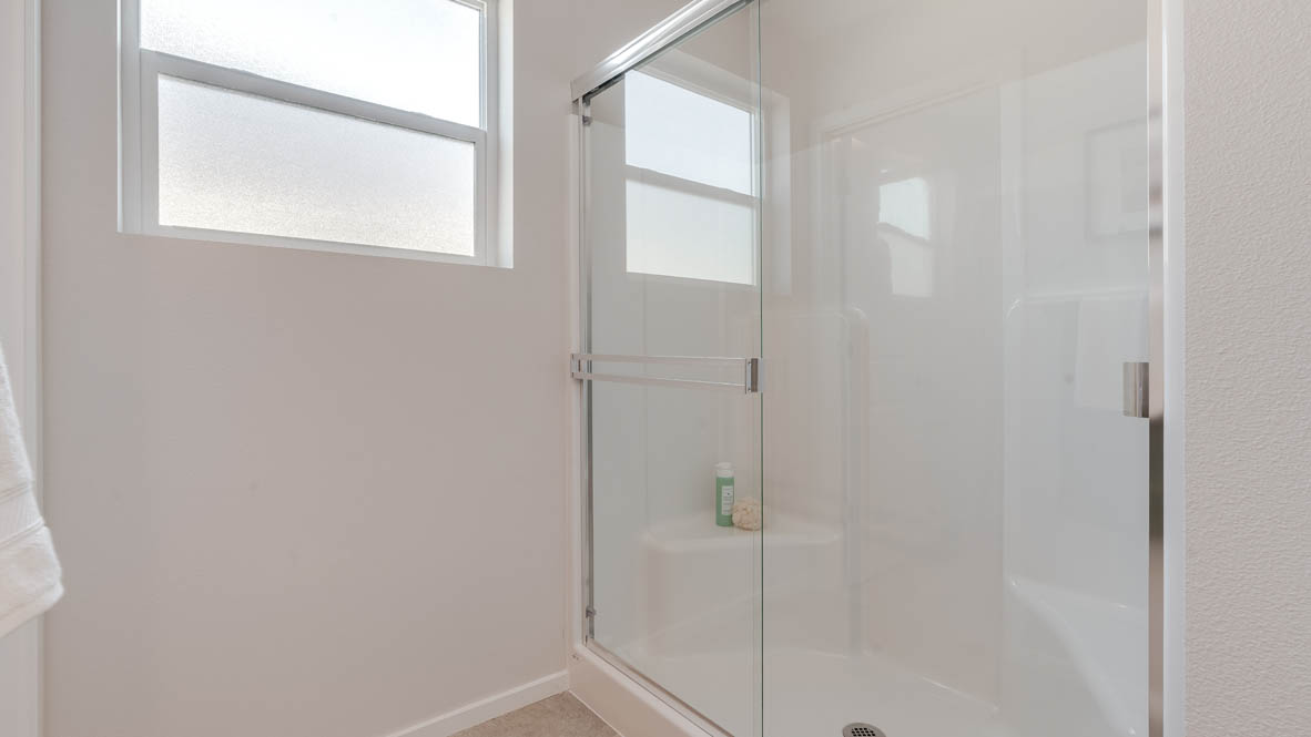 Marcola Meadows Primary bathroom with a window, and a walk in shower