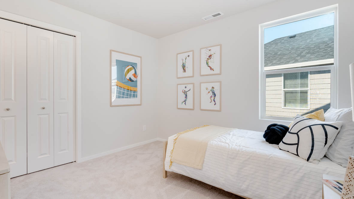 Marcola Meadows bedroom with bed, white walls, pillows, carpet, windows, and closet