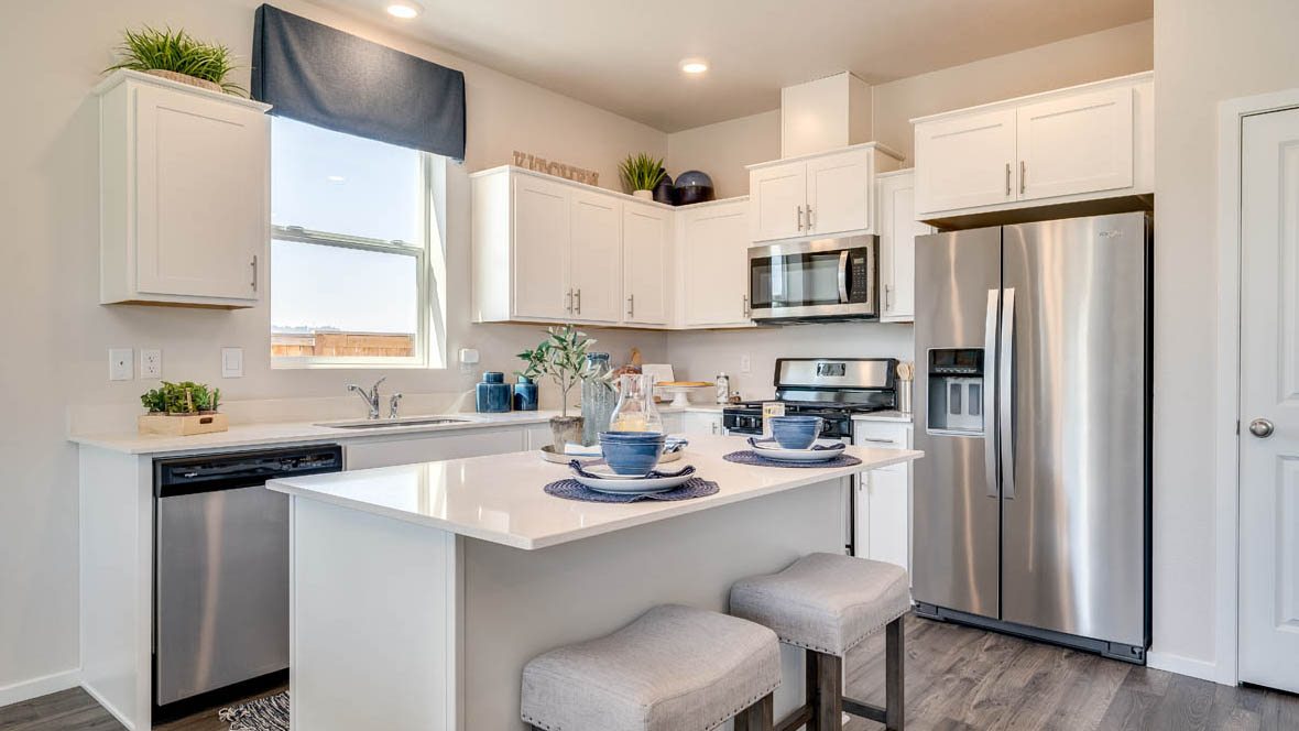 Marcola Meadows Kitchen with white cabinet, an island, stainless steel kitchen appliances