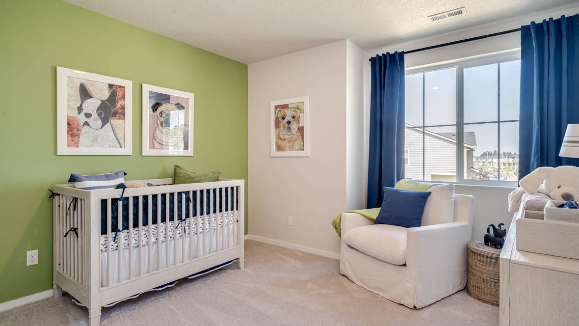 Marcola Meadows Room with baby bed and green accent wall