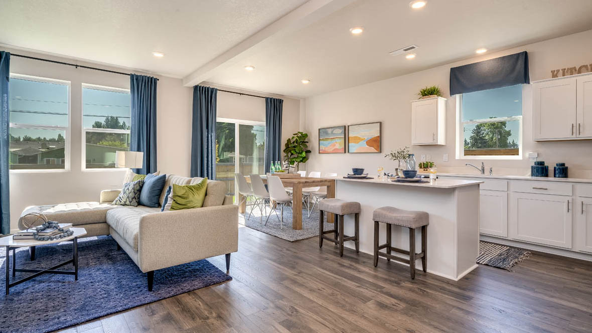 Marcola Meadows Great room and dining room with windows and patio door