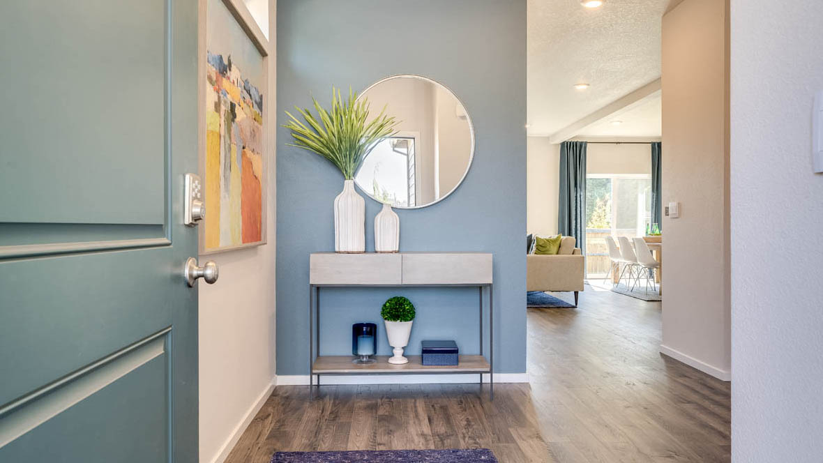 Marcola Meadows Door open to the front entryway of the model home at Marcola Meadow