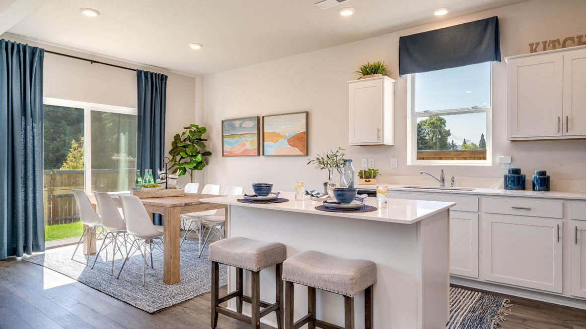 Marcola Meadows Kitchen with white cabinet, an island, stainless steel kitchen appliances