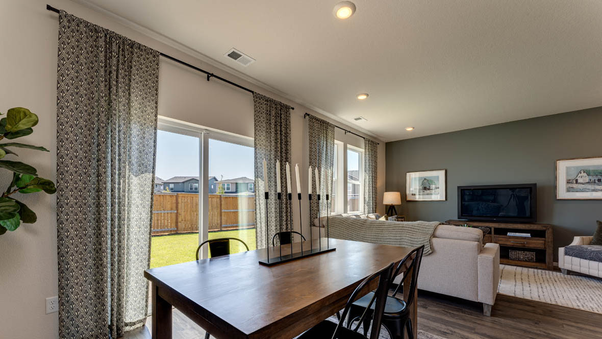 Marcola Meadows Living room and dining room with two windows and patio door
