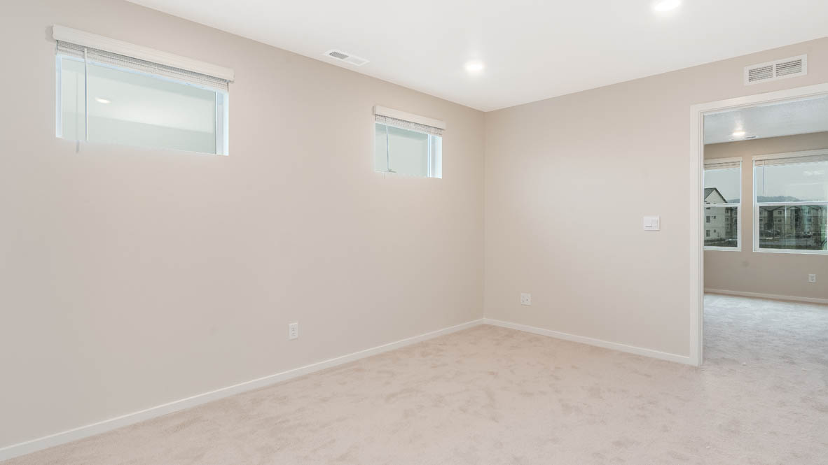 Marcola Meadows Loft with white walls, carpet, and windows