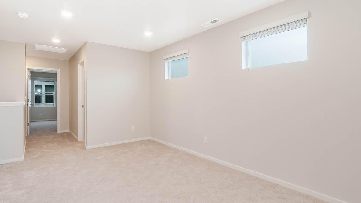 Marcola Meadows Loft with white walls, carpet, view of hallway, and windows
