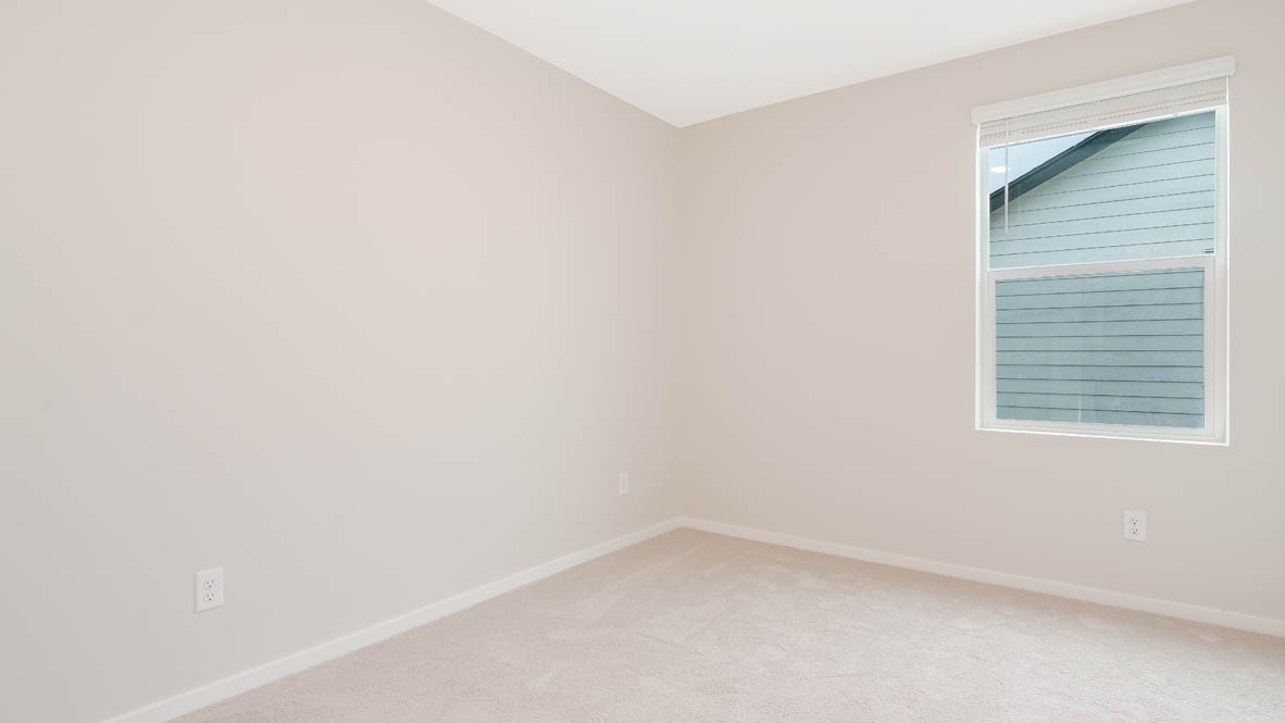 Marcola Meadows bedroom with window, carpet, and walls