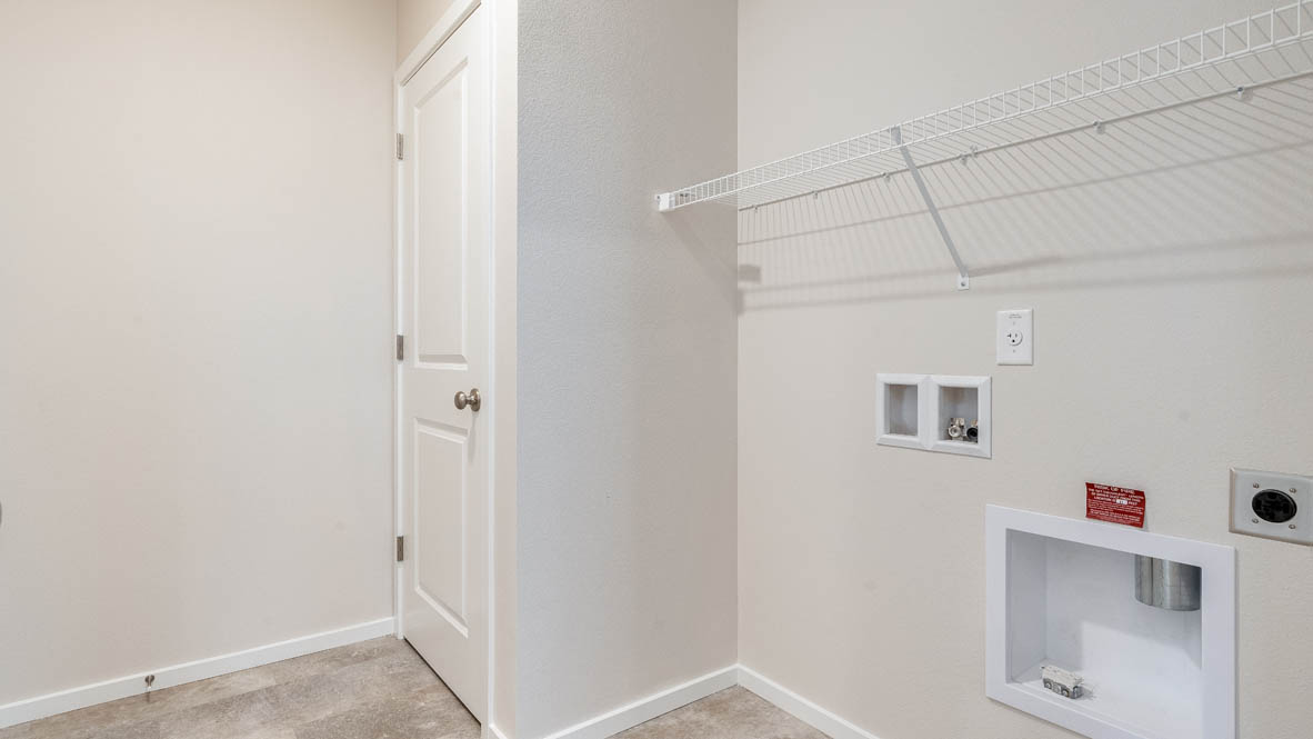 Marcola Meadows Laundry Room with white wire shelving, flooring, and walls