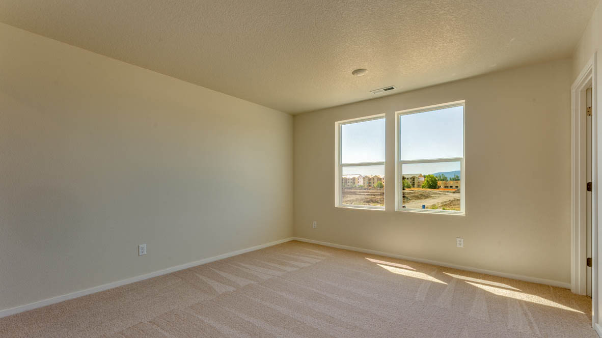 Marcola Meadows Bedroom with windows and carpeting