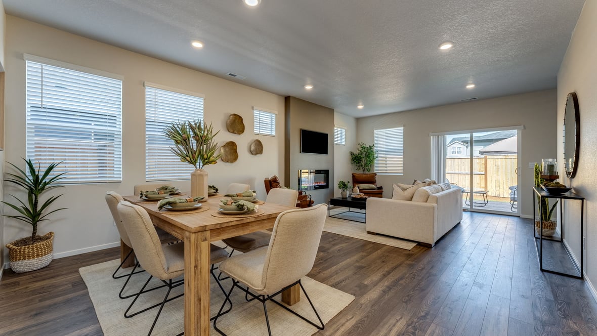 Marcola Meadows Modern open-concept living and dining area with a fireplace