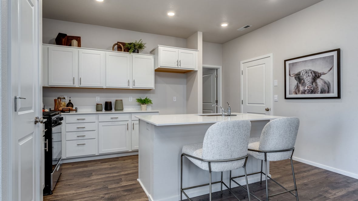 Marcola Meadows Kitchen with white cabinet, quartz countertops, and an island