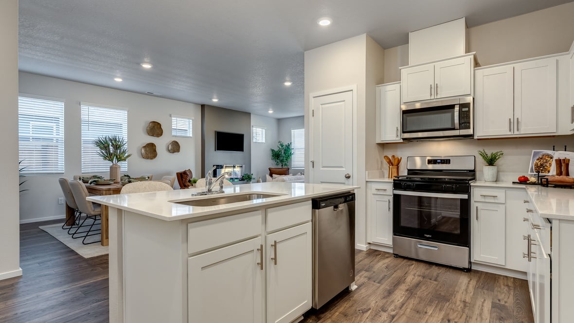 Marcola Meadows Kitchen with white cabinet, quartz countertops, and an island