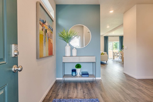 Marcola Meadows Door open to the front entryway of the model home at Marcola Meadow