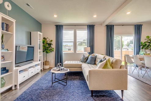 Marcola Meadows Great room and dining room with windows and patio door