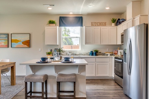 Marcola Meadows Kitchen with white cabinet, an island, stainless steel kitchen appliances