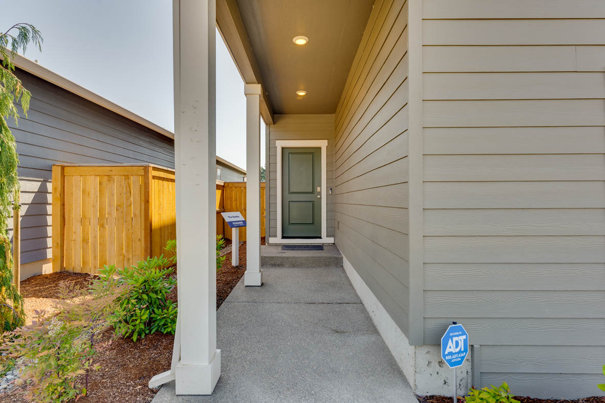 Marcola Meadows Covered front porch and green door