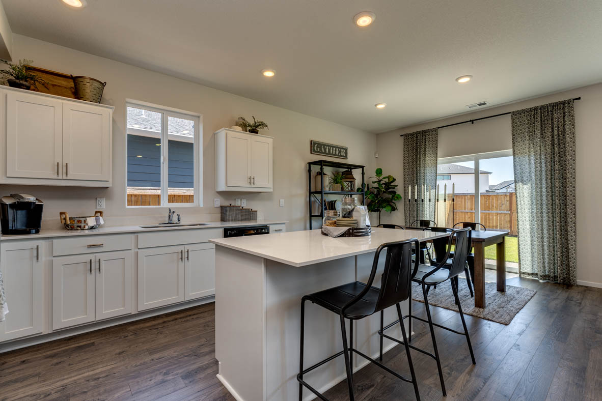 Marcola Meadows Kitchen with white cabinet, an island