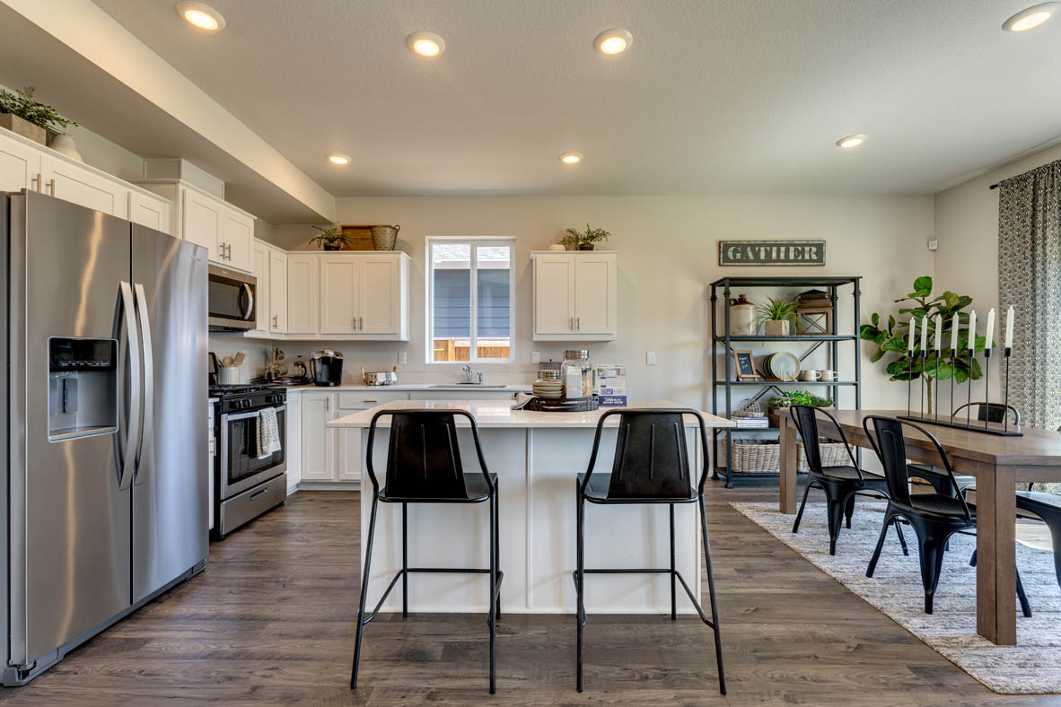 Marcola Meadows Kitchen with white cabinet, an island, stainless steel kitchen appliances