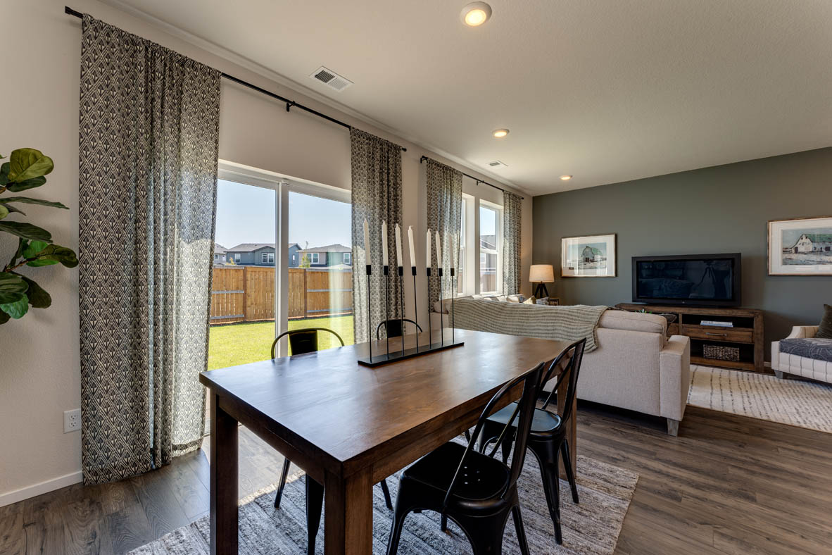 Marcola Meadows Living room and dining room with two windows and patio door