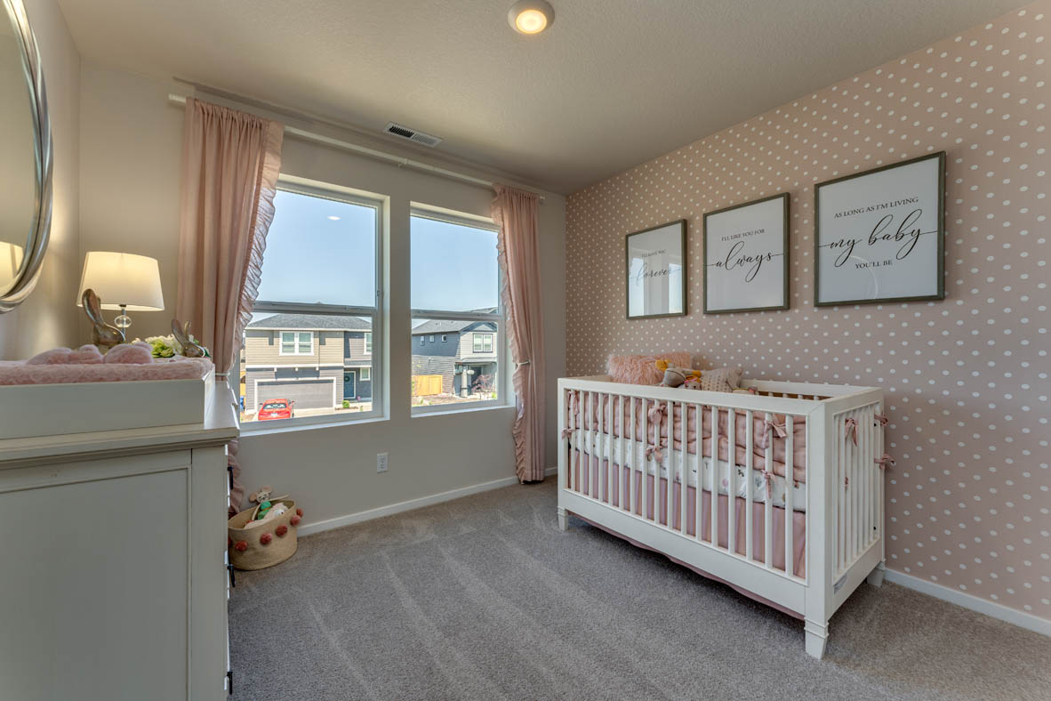 Marcola Meadows Pink theme bedroom with baby crate and two windows