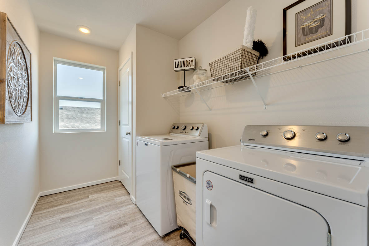 Marcola Meadows Laundry room with shelf and a window