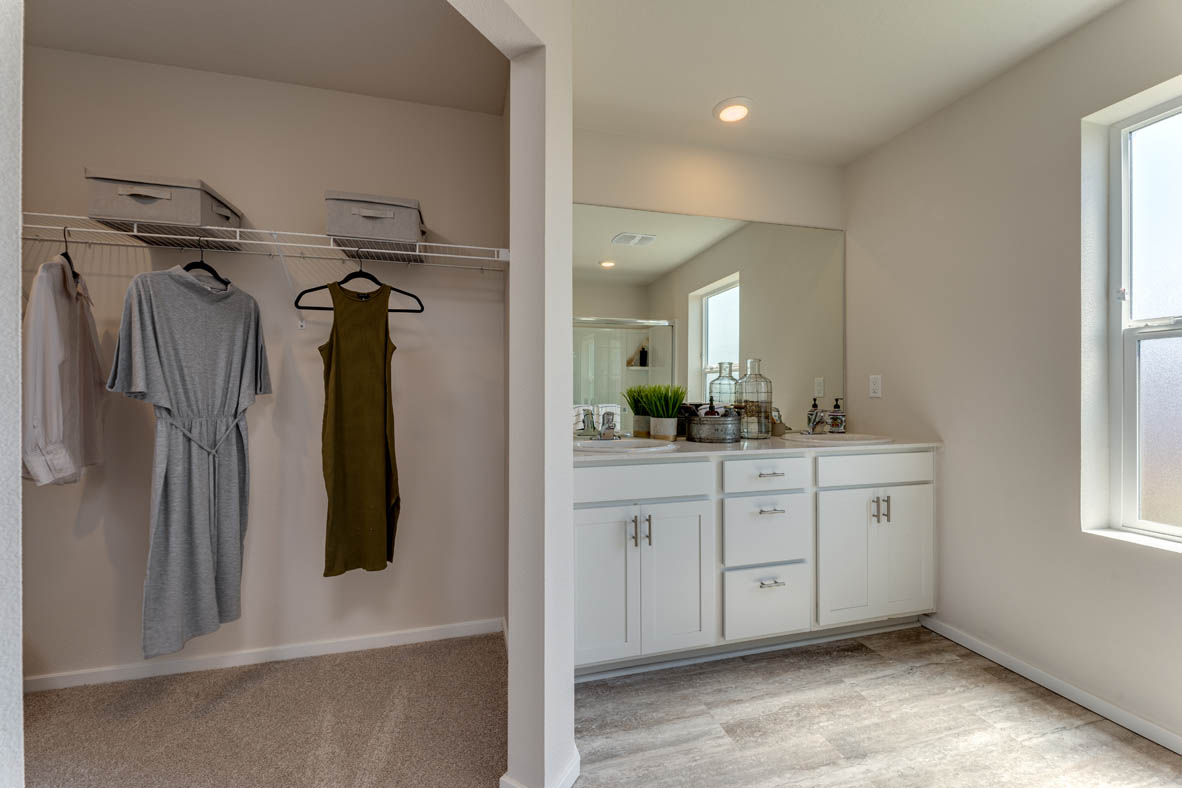 Marcola Meadows Closet space next to the double sink vanity with a wall in between