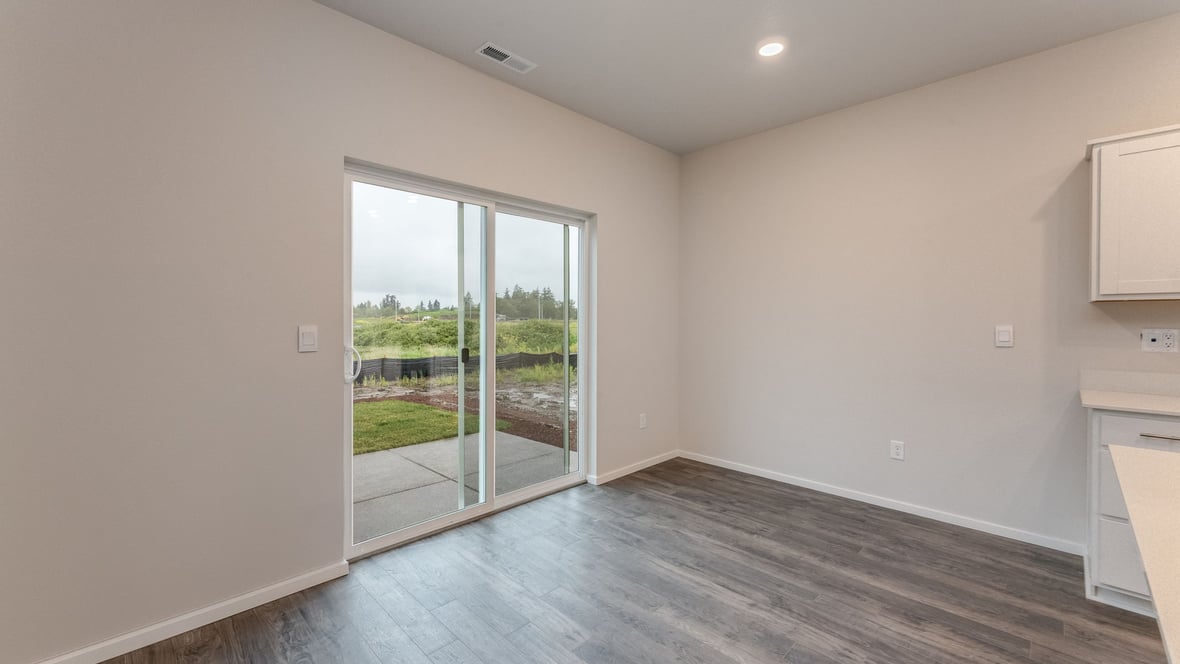 Marcola Meadows Spacious dining area with two windows with patio door right next to it