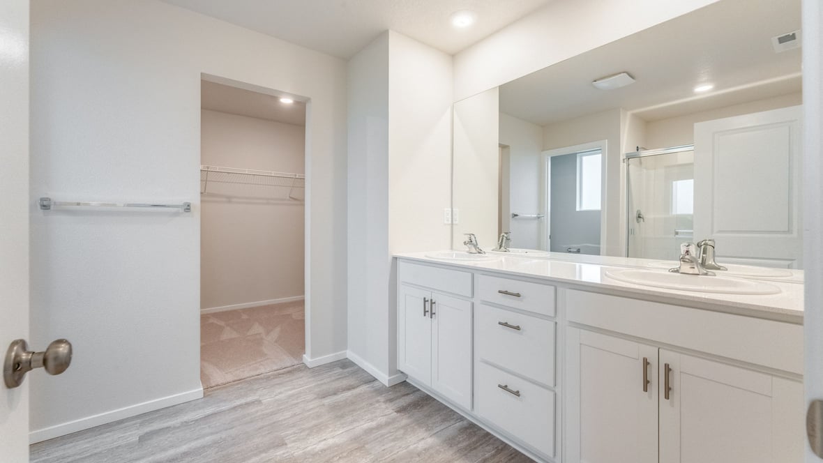 Marcola Meadows Bright bathroom that includes double sinks vanity with white cabinet and quartz countertops