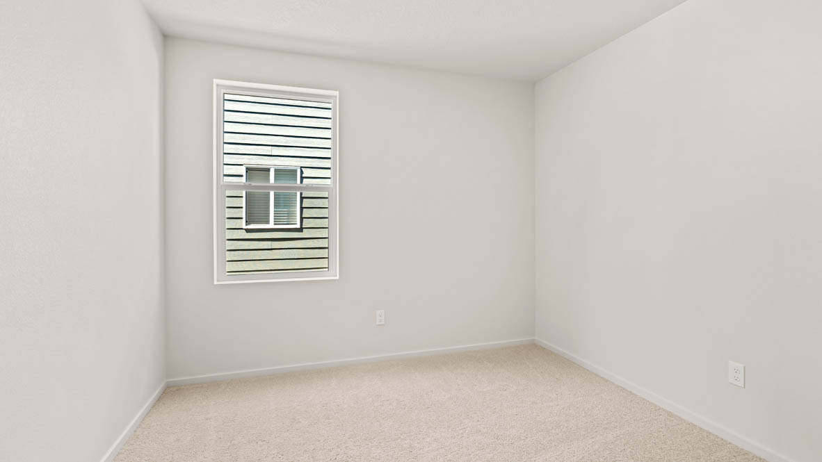 Eden Estates bedroom with carpet, window, and white walls