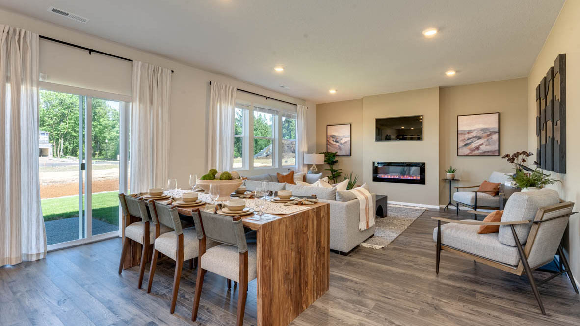 Eden Estates Dining room and Kitchen with a table with four chairs, solid quartz countertops, in-island sink with a breakfast bar, stainless steel appliances, shaker style cabinets, pantry