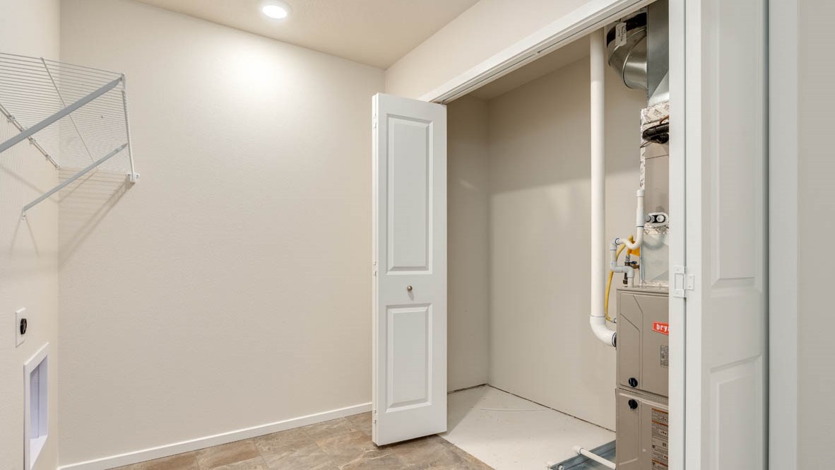 Eden Estates bathroom with toilet, and white shower tub