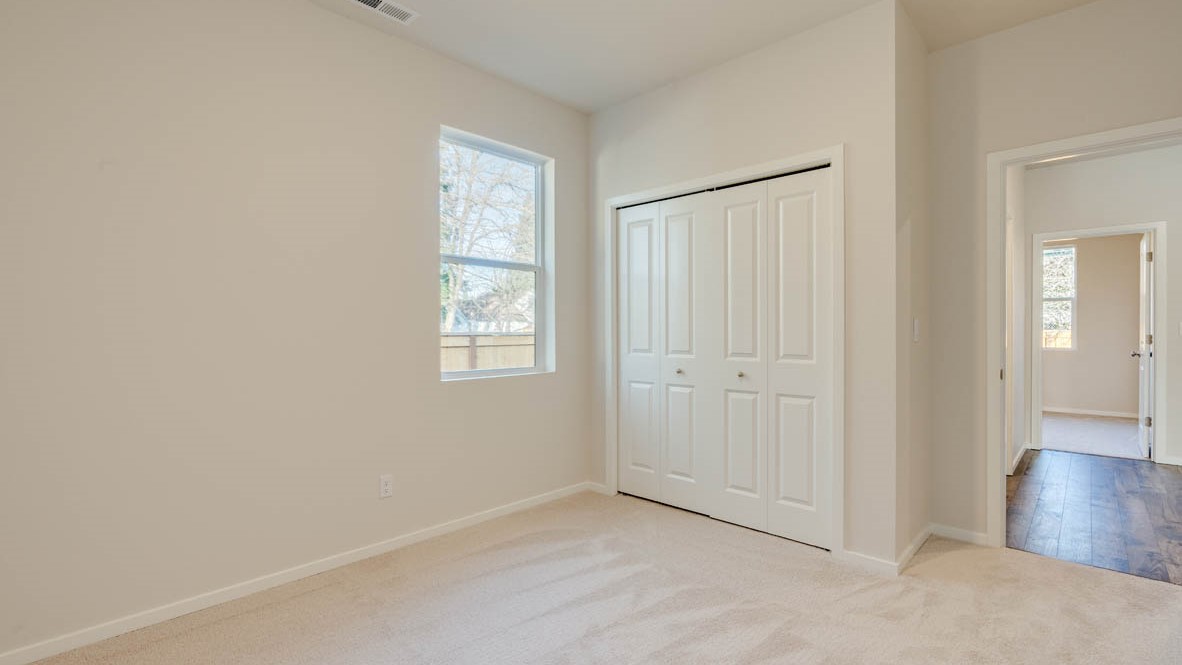 Eden Estates walk in closet with white wire shelving