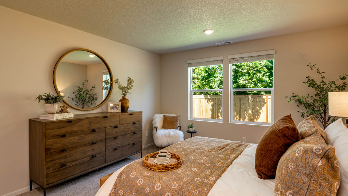 Eden Estates bedroom with carpet, window, and white walls