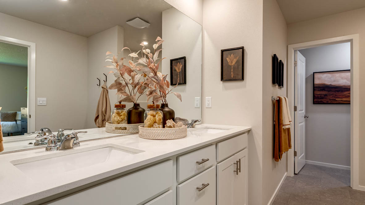 Eden Estates bathroom with toilet, and white shower tub