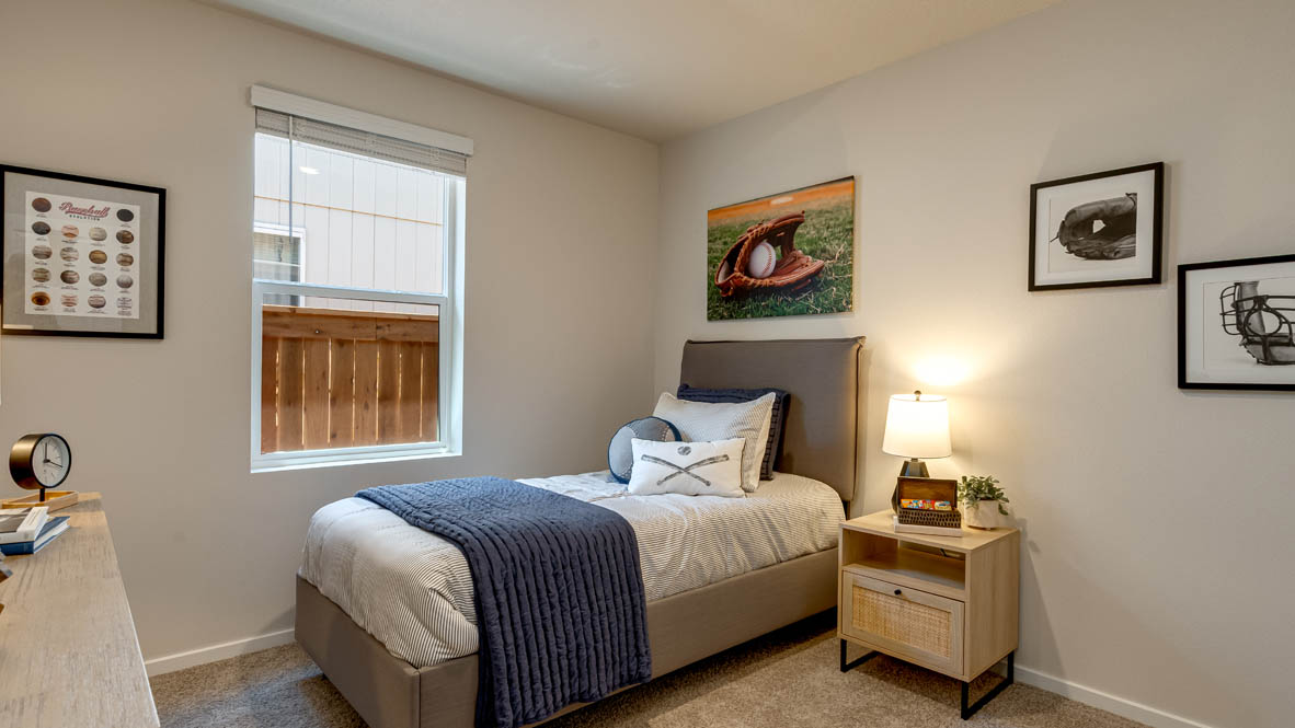 Eden Estates bedroom with carpet, window, and white walls